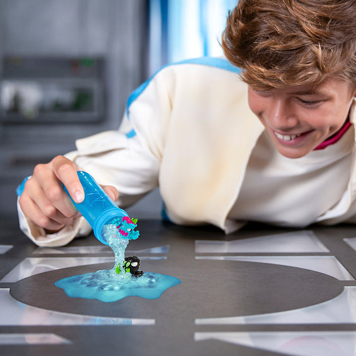 Boy joyfully releasing fizz from MrBeast Lab Swarms test tube, watching colorful micro beasts emerge.