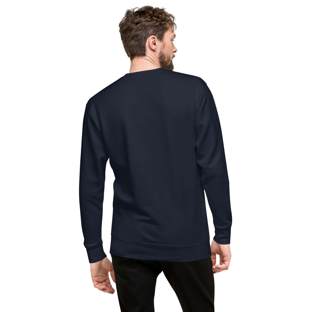 Model wearing a navy Earthlets unisex premium sweatshirt from the back, showcasing its classic silhouette.