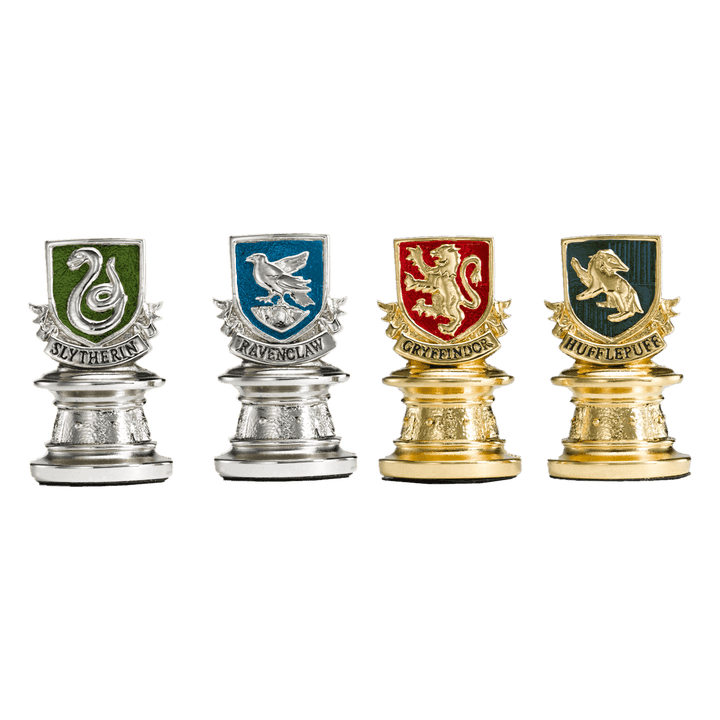 Quidditch Chess Set pieces representing Slytherin, Ravenclaw, Gryffindor, and Hufflepuff houses.