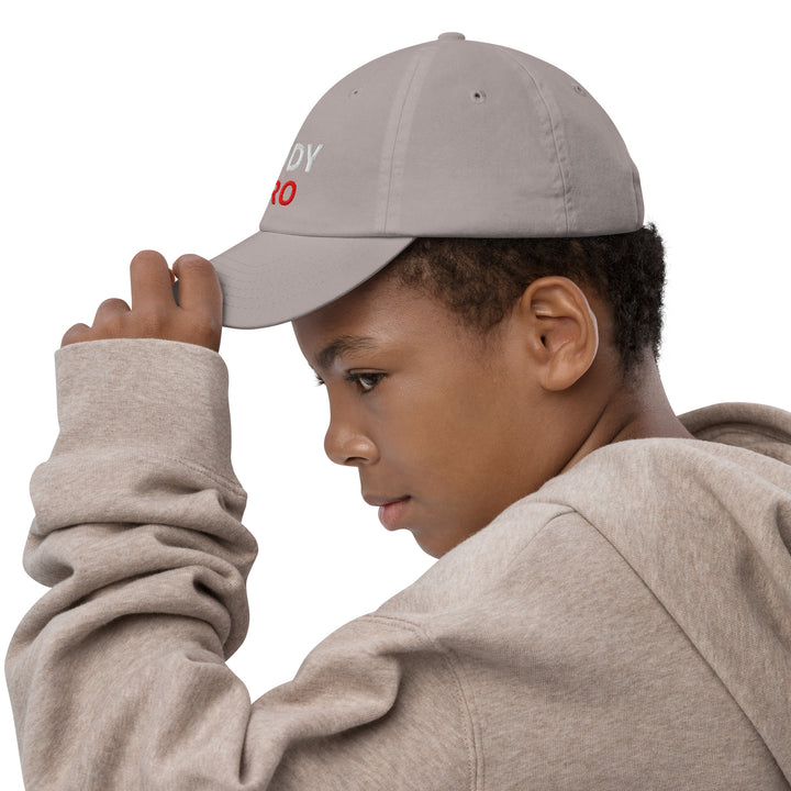 Oddy Pro Youth baseball cap worn by a boy, showcasing comfort and style during outdoor activities.
